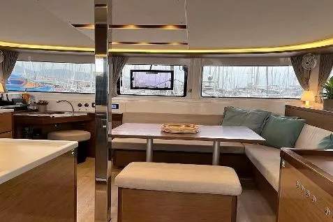  Yacht Photos Pics Interior of 2020 Lagoon 46 catamaran with modern dining area and large windows.