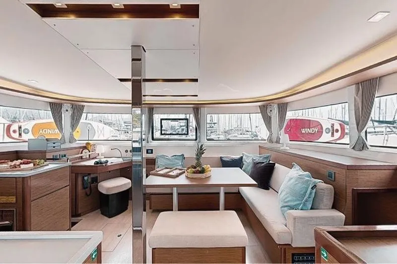  Yacht Photos Pics Luxurious interior of a 2020 Lagoon 46 catamaran with modern furnishings and panoramic windows.