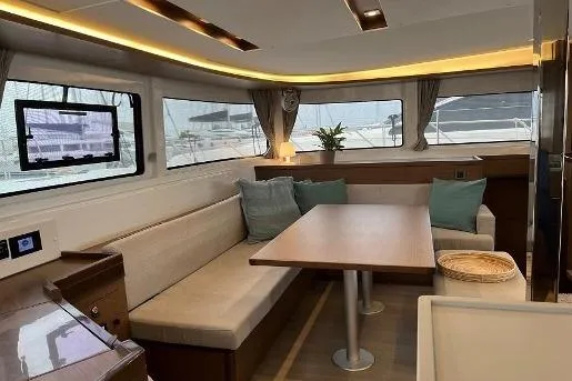  Yacht Photos Pics Interior of 2020 Lagoon 46 yacht with modern seating and dining area.