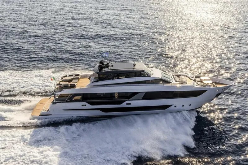  Yacht Photos Pics Luxurious 2022 Ferretti Yachts 1000 SKYDECK cruising on open water.