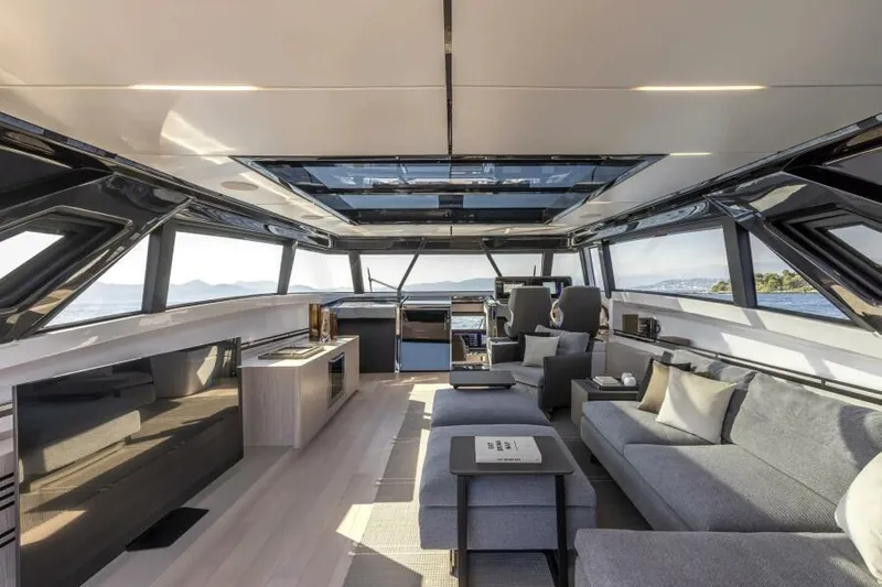  Yacht Photos Pics Luxurious interior of 2022 Ferretti Yachts 1000 SKYDECK with panoramic windows and modern furnishings.