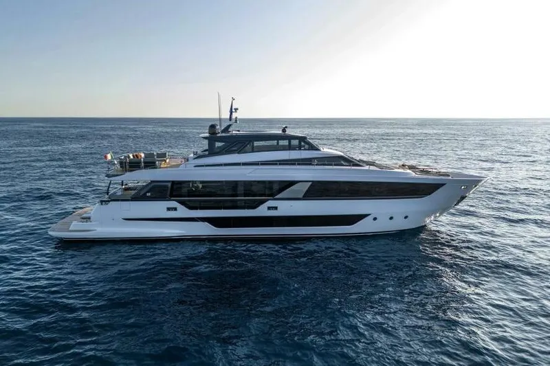  Yacht Photos Pics 2022 Ferretti Yachts 1000 SKYDECK cruising on open sea, side view.