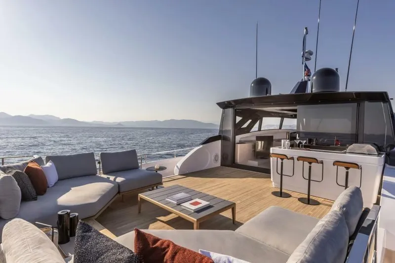  Yacht Photos Pics Luxurious 2022 Ferretti Yachts 1000 SKYDECK with elegant outdoor seating and ocean view.