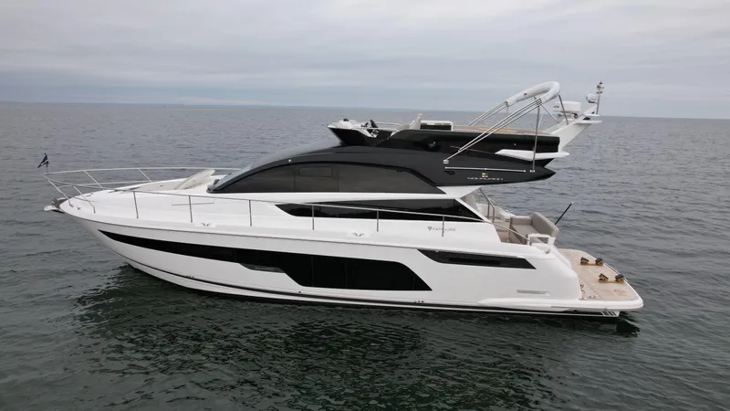  Yacht Photos Pics 2024 Fairline Squadron 50 luxury yacht cruising on open water.