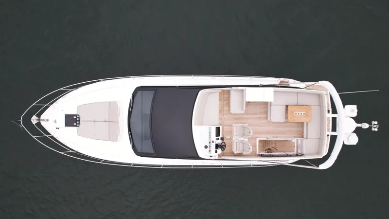  Yacht Photos Pics Top view of 2024 Fairline Squadron 50 luxury yacht on water.