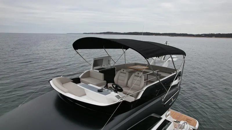  Yacht Photos Pics 2024 Fairline Squadron 50 luxury yacht with spacious flybridge on calm waters.