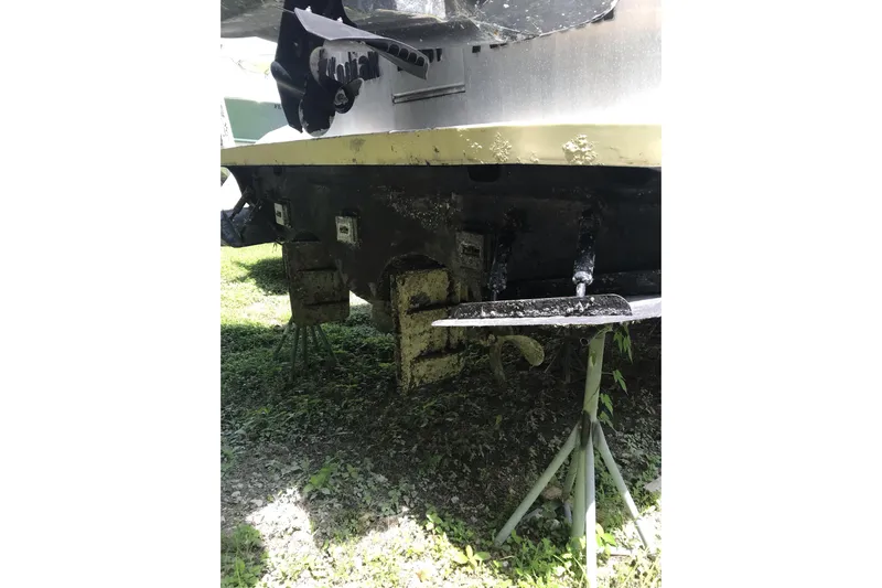 Tuff Baby Yacht Photos Pics 1999 Custom Sport Fishing boat hull on stands, showing propeller and rudder.