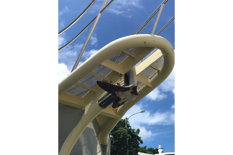 Tuff Baby Yacht Photos Pics Custom 1999 Sport Fishing boat with a unique bow design against a clear blue sky.