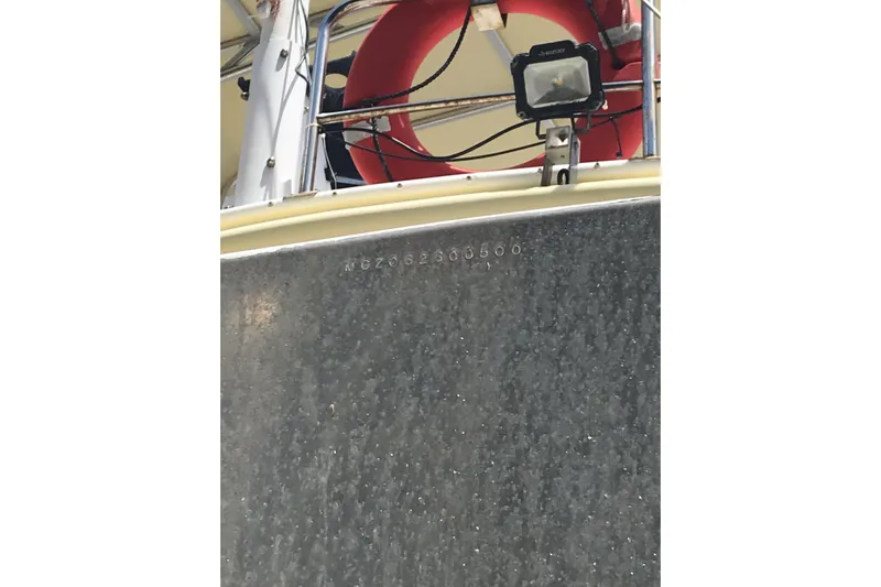 Tuff Baby Yacht Photos Pics Custom 1999 Sport Fishing boat with life preserver and spotlight on deck.