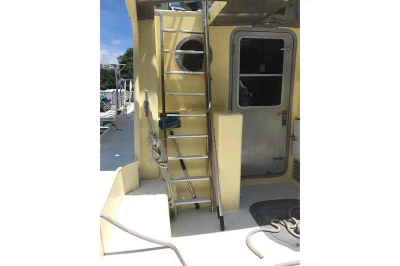 Tuff Baby Yacht Photos Pics 1999 Custom Sport Fishing boat with ladder and cabin door.