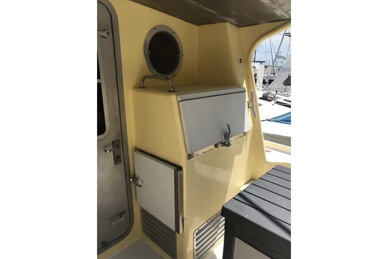 Tuff Baby Yacht Photos Pics 1999 Custom Sport Fishing boat interior with storage compartments and porthole.