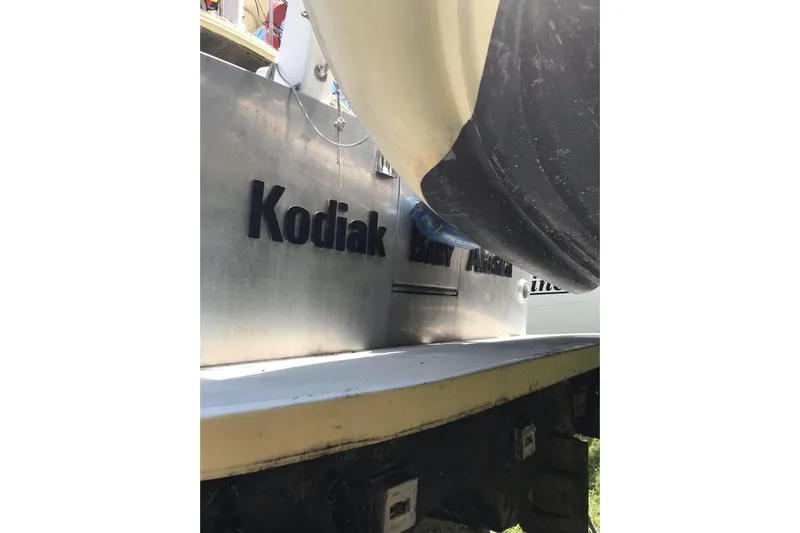 Tuff Baby Yacht Photos Pics Custom 1999 sport fishing boat with "Kodiak" lettering, docked in Alaska.