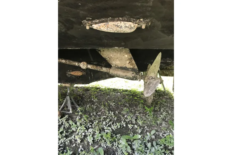 Tuff Baby Yacht Photos Pics Underside of a 1999 Custom Sport Fishing boat showing propeller and rudder.