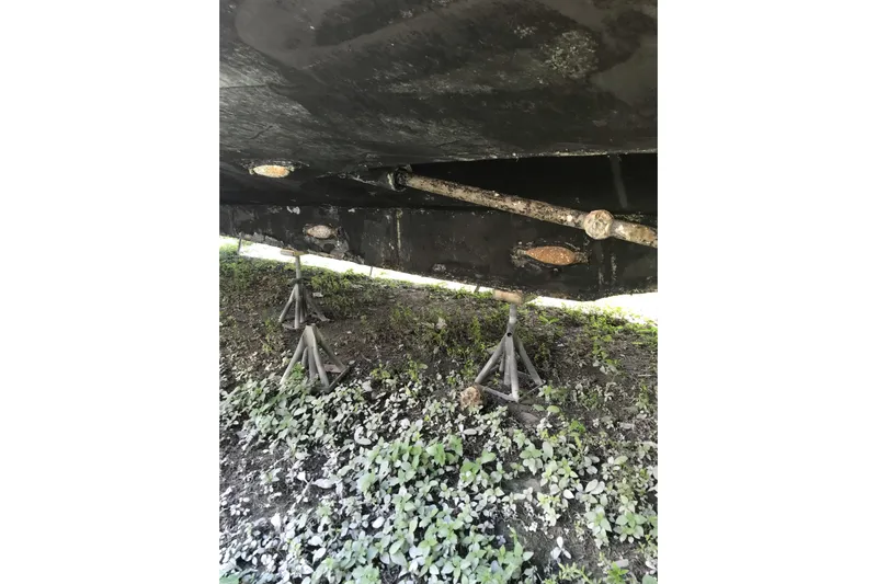 Tuff Baby Yacht Photos Pics Underside of a 1999 Custom Sport Fishing boat on stands, showing propeller shaft.