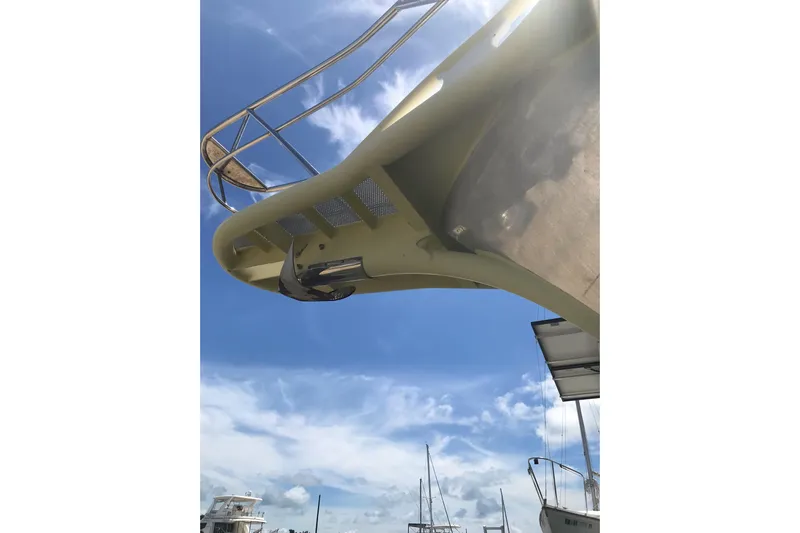 Tuff Baby Yacht Photos Pics Custom 1999 Sport Fishing boat with blue sky background, featuring a sleek design.