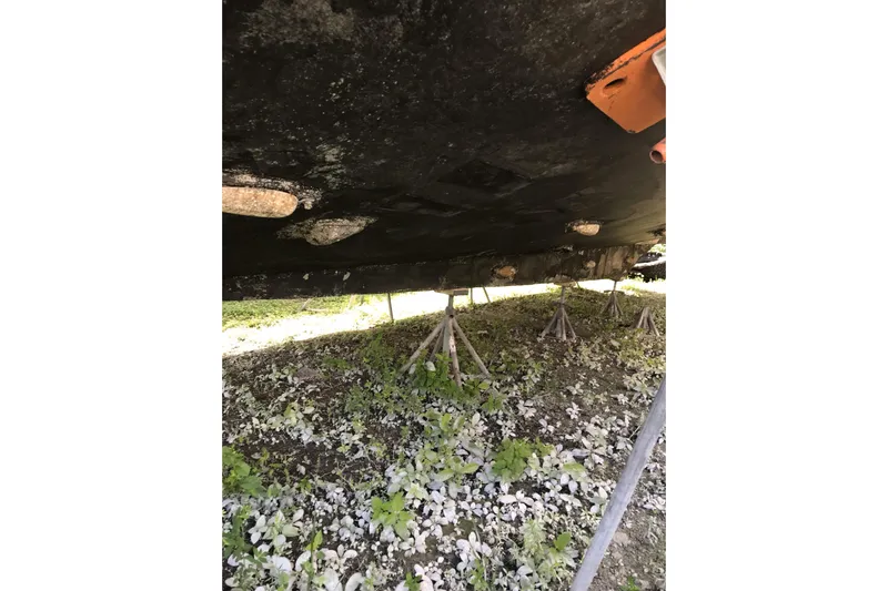 Tuff Baby Yacht Photos Pics Underside of a 1999 Custom Sport Fishing boat on stands, showing hull details.