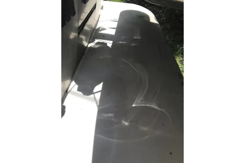 Tuff Baby Yacht Photos Pics Shadow of a 1999 Custom Sport Fishing boat on a sunny day.