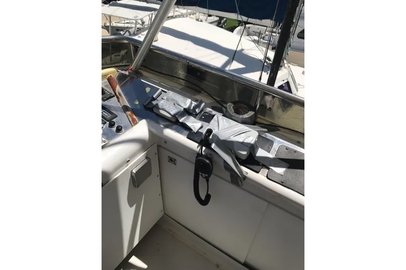 Tuff Baby Yacht Photos Pics 1999 Custom Sport Fishing boat cockpit with duct-taped equipment and control panel.