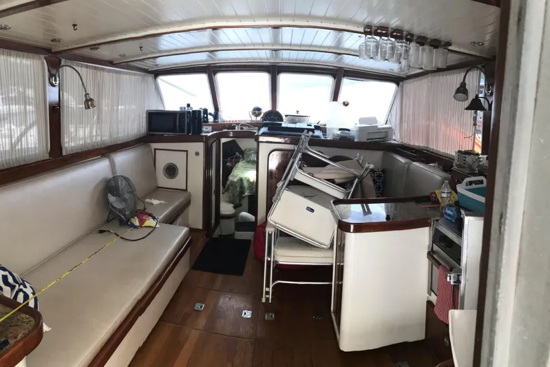 Tuff Baby Yacht Photos Pics Interior of a 1999 Custom Sport Fishing boat with seating and kitchen area.