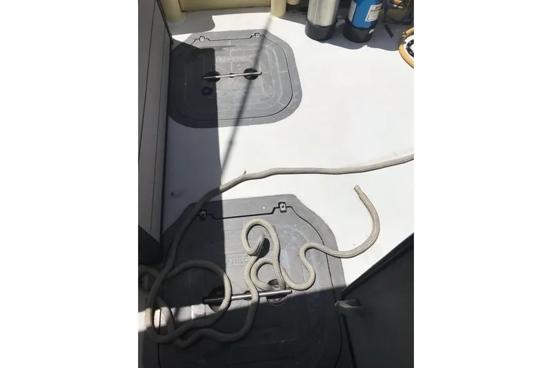 Tuff Baby Yacht Photos Pics Deck of 1999 Custom Sport Fishing boat with ropes and storage hatches.