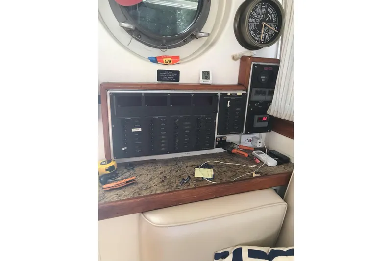 Tuff Baby Yacht Photos Pics Control panel inside a 1999 Custom Sport Fishing boat, featuring various instruments and tools.