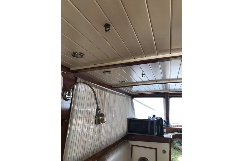 Tuff Baby Yacht Photos Pics Interior of a 1999 Custom Sport Fishing boat with wood paneling and modern amenities.