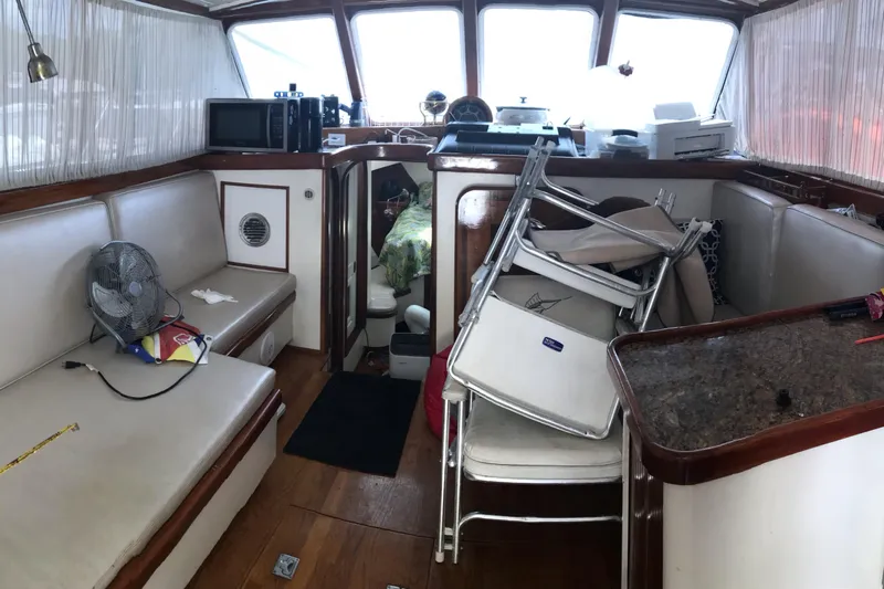 Tuff Baby Yacht Photos Pics Interior of a 1999 custom sport fishing boat with seating and stacked chairs.