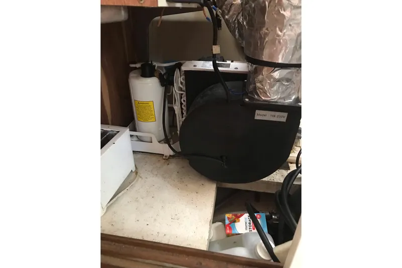 Tuff Baby Yacht Photos Pics Engine compartment of a 1999 Custom Sport Fishing boat, showing mechanical components.