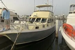 Tuff Baby Yacht Photos Pics Custom 1999 Sport Fishing boat docked at marina, surrounded by other vessels.