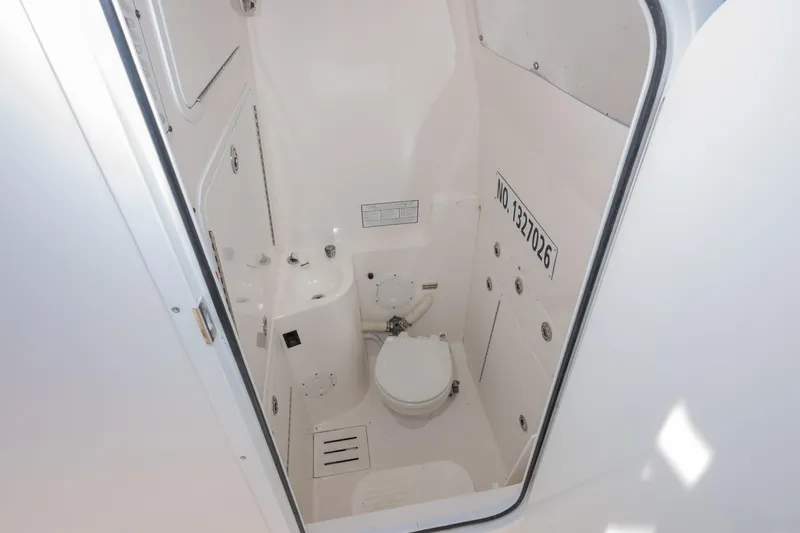 Traveller Yacht Photos Pics 2008 Regulator 32 Forward Seating boat interior bathroom with toilet and sink.