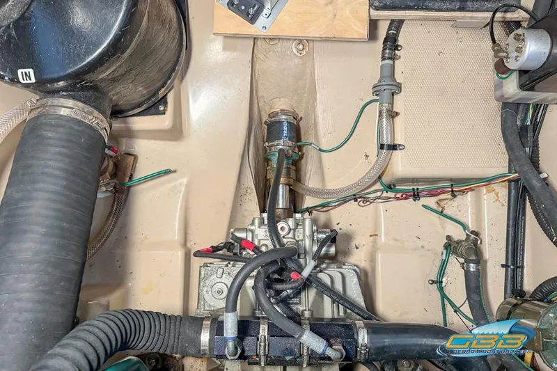  Yacht Photos Pics Engine compartment of a 2013 Cutwater C-28 boat, showing hoses and mechanical components.