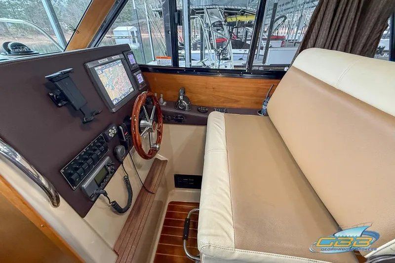  Yacht Photos Pics 2013 Cutwater C-28 boat interior with navigation controls and seating area.
