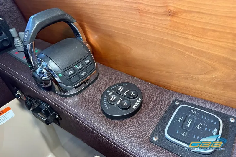  Yacht Photos Pics Control panel of a 2013 Cutwater C-28 boat with joystick and buttons.