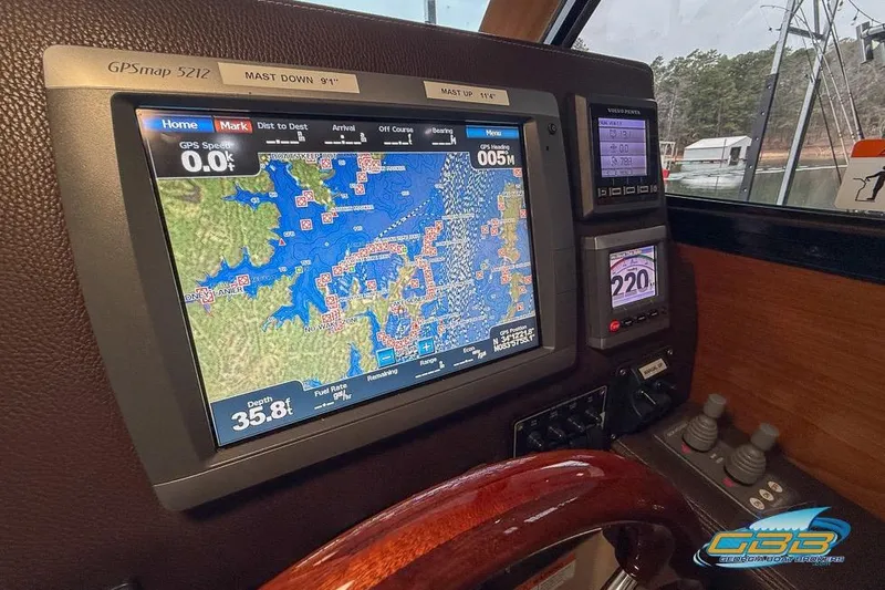  Yacht Photos Pics GPS navigation system on a 2013 Cutwater C-28 boat dashboard, displaying a detailed map.