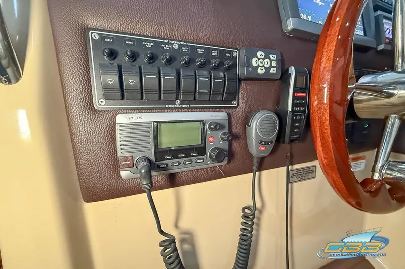  Yacht Photos Pics Control panel of a 2013 Cutwater C-28 boat with VHF radio and switches.