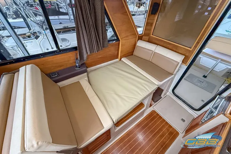  Yacht Photos Pics 2013 Cutwater C-28 interior with convertible seating and wood accents.