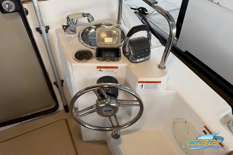  Yacht Photos Pics 2013 Cutwater C-28 boat helm with steering wheel and controls.