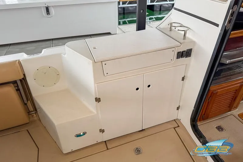  Yacht Photos Pics 2013 Cutwater C-28 boat interior with storage cabinets and cup holders.