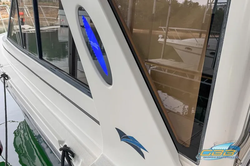  Yacht Photos Pics 2013 Cutwater C-28 boat with sleek design and blue accent, docked at marina.