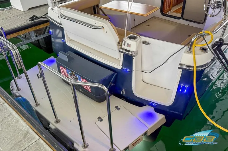  Yacht Photos Pics 2013 Cutwater C-28 boat with illuminated deck and American flag detail.