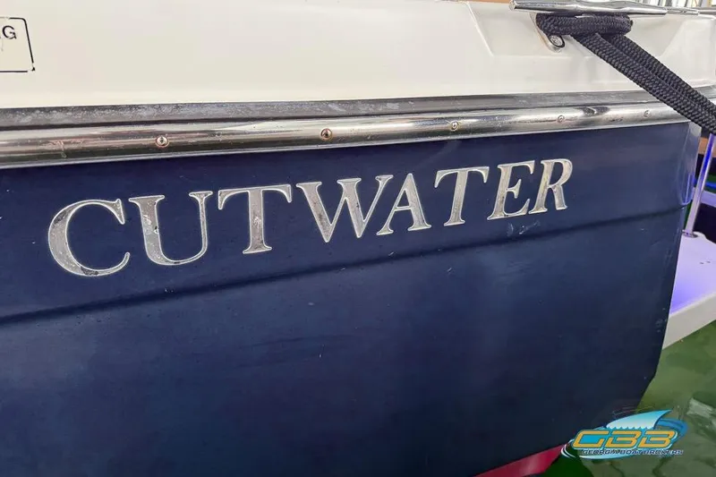  Yacht Photos Pics 2013 Cutwater C-28 boat with blue hull and silver lettering.