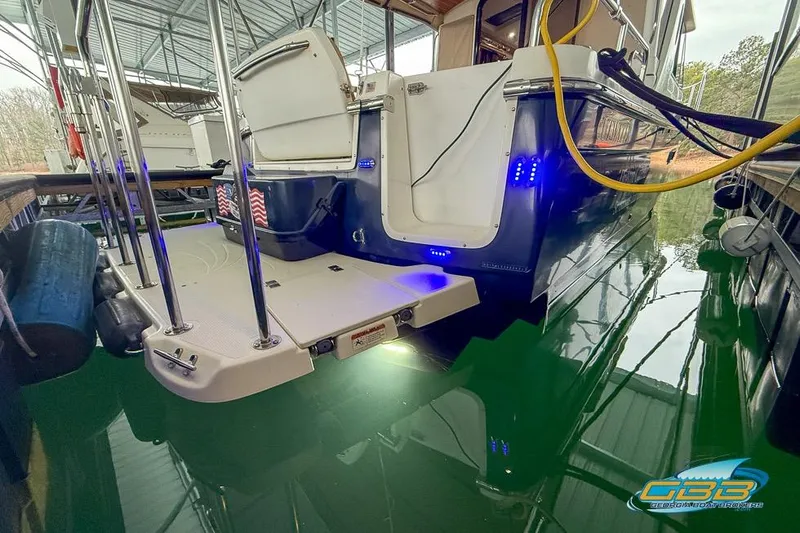  Yacht Photos Pics 2013 Cutwater C-28 boat docked, featuring swim platform and blue LED lights.