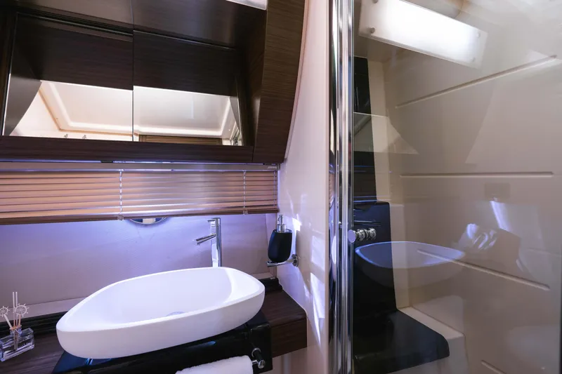 Kenostar Yacht Photos Pics Luxurious bathroom interior of 2015 Azimut 55S yacht with modern sink and sleek design.