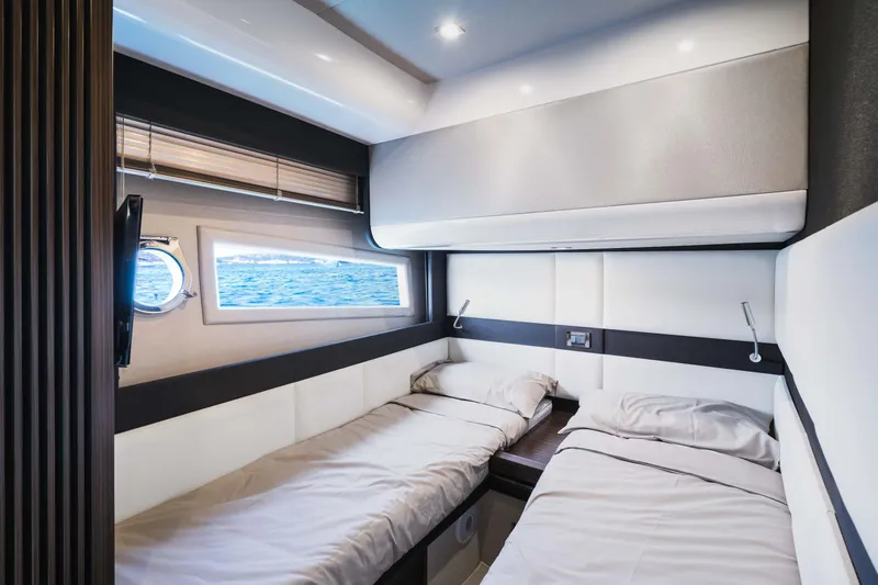 Kenostar Yacht Photos Pics Luxurious cabin interior of 2015 Azimut 55S yacht with twin beds and ocean view.