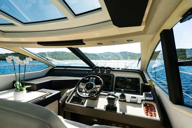 Kenostar Yacht Photos Pics Luxurious 2015 Azimut 55S yacht cockpit with modern controls and panoramic ocean view.