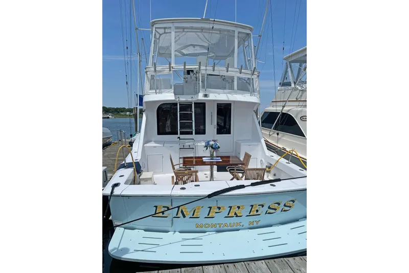 Empress Yacht Photos Pics Hatteras 60 Convertible yacht, 2000 model, docked in Montauk, NY, with outdoor seating.
