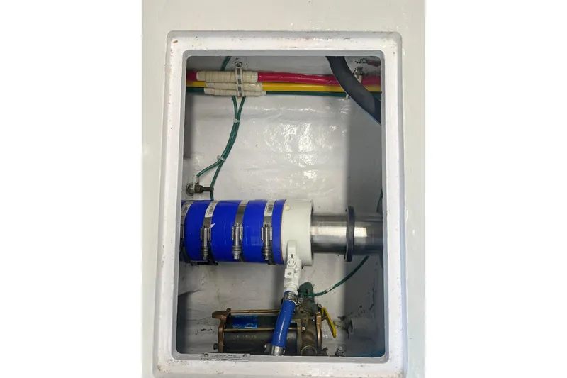 Empress Yacht Photos Pics Engine compartment of a 2000 Hatteras 60 Convertible yacht, showing mechanical components.