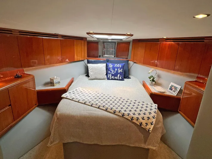 Empress Yacht Photos Pics Luxurious cabin interior of 2000 Hatteras 60 Convertible yacht with cozy bedding.
