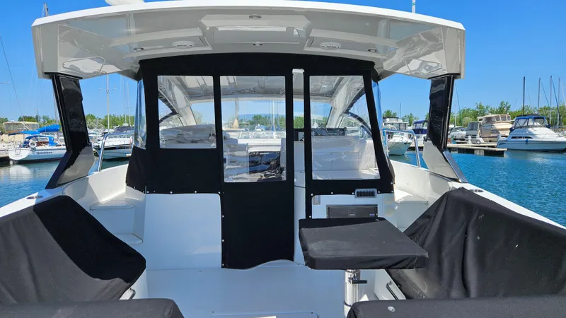  Yacht Photos Pics 2017 Cruisers Yachts 390 Express Coupe at marina, featuring covered seating area.