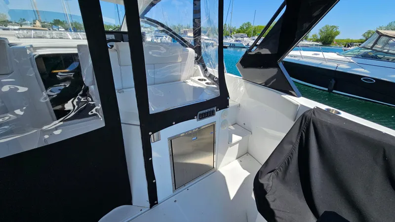  Yacht Photos Pics 2017 Cruisers Yachts 390 Express Coupe interior with sleek design and marina view.